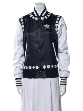 adidas Blue  and White Jacket
It’s a collaboration with Pharrell Williams